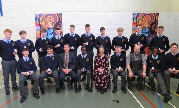Fifth year award winners (back l/r) Jack Doyle, Jake Murphy, Ryan Donnelly Finn, Michael Brophy, Conor Dowling, Killian McCutcheon, Mateusz Dopierala, Jan Flejszar, William, Hackett and Patrick Walshe (front l/r) Calin Iancu, David Chira, Sean Kealy deputy principal, Frank Ndahiro, principal Fiona Lennon, Brian Farrell, Shane Story year head, Fred Ndahiro and Jack Hynds