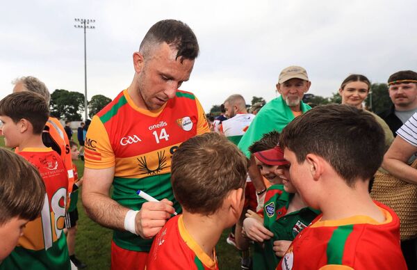 Darragh Foley signs the jerseys of young Carlow supporters Photo: ©INPHO/Evan Treacy