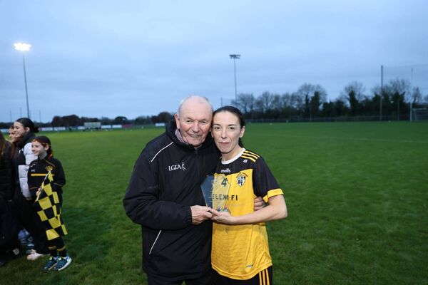 Player of the Match Leah Mullins shows her award to her father Fran Photo: Pat Ahern