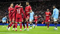 Liverpool move nine points clear at top after heaping more misery on Man City