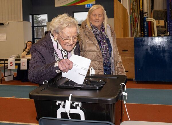 On her 100th birthday, Bridget Delaney accompanied by her daughter Phil casts her vote Photo: michaelorourkephotography.ie