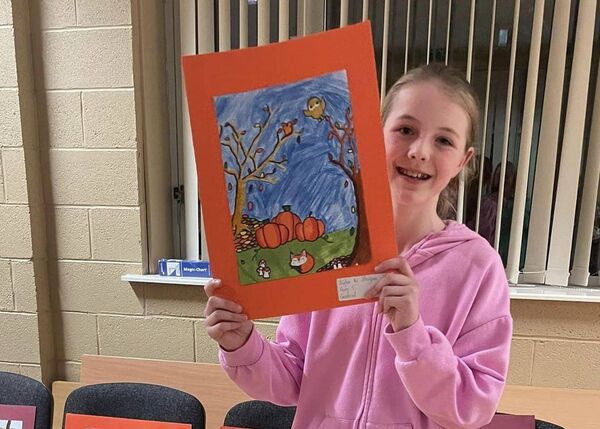 Síofra Ní Bholgúir with her painting of Halloween pumpkins