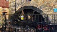 Water wheel starts turning again to power restaurant at historic mill