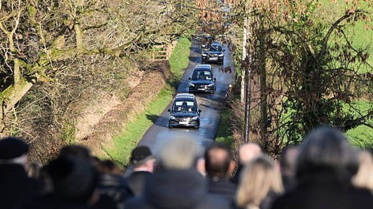 Community still in shock over deaths of father and son, funeral told