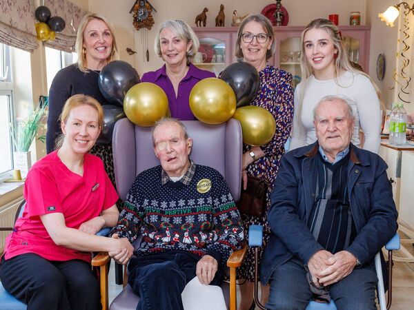 Noel with his daughters Elizabeth, Olive and Clare, granddaughter Ella, his brother Tommy and Oksana Gavrilova, activities co-ordinator at Beechwood Nursing Home