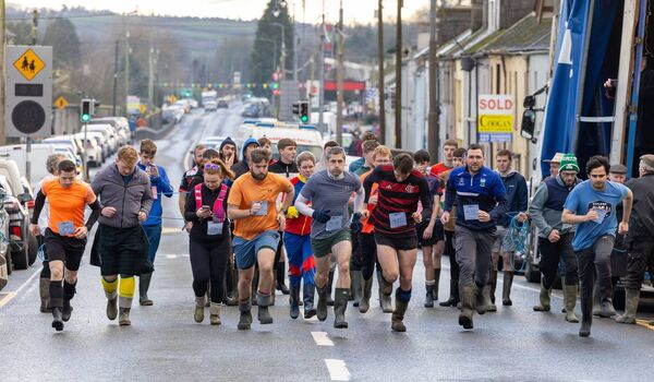 Senior runners in the Wellie Race 2025 make a dash for the finishing line 
