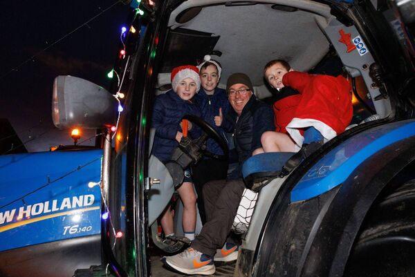 John McDonald with his children Conor, Dara and Sean took part in the tractor run to raise funds for Killeshin Ladies GAA team Photos: michaelorourkephotography.ie