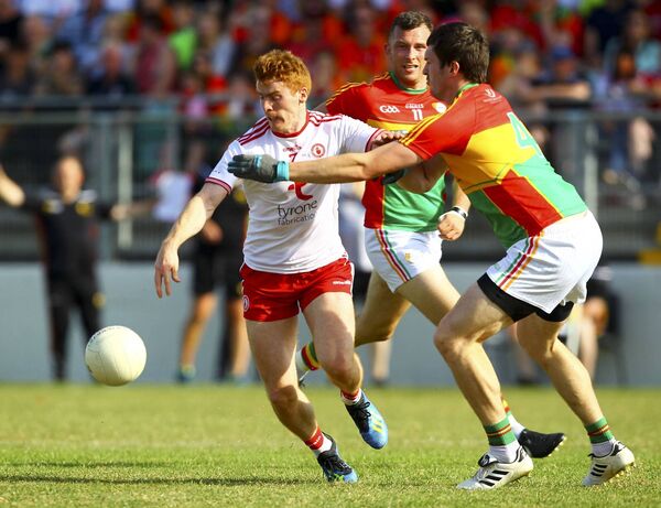 Tackling Tyrone's Peter Harte during the 2018 All-Ireland series Photo: ©INPHO/Ken Sutton Tackling Tyrone's Peter Harte during the 2018 All-Ireland series Photo: ©INPHO/Ken Sutton