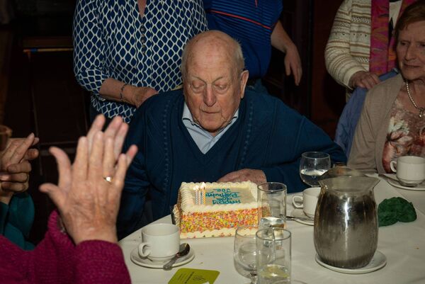 Joe O'Neill blows out the candles on his birthday cake