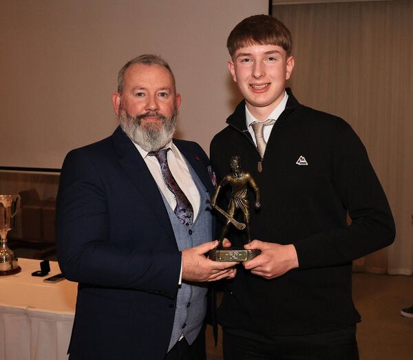 Ciaran Bolger presents Sam Myler with the Burren Rangers Minor Hurling Player of the Year Award