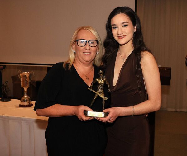 Lisa Raleigh presents Róisín Connolly with the Burren Rangers Senior Camogie Player of the Year Award