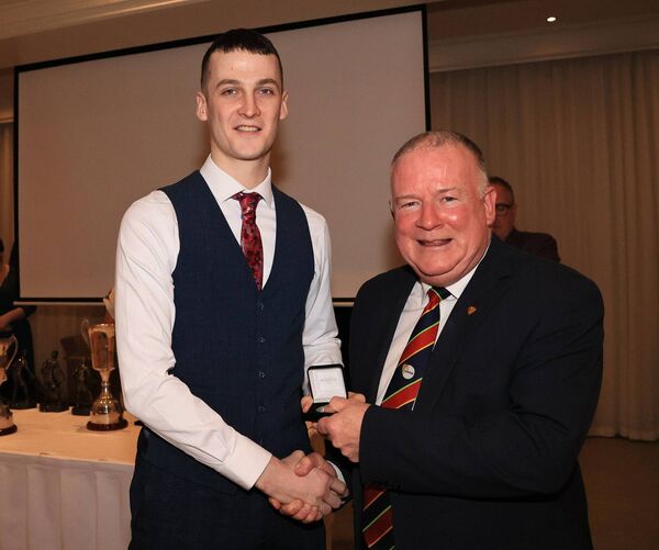 Billy Molloy receives his medal Junior championship medal from Jim Bolger, Carlow GAA Chairman.