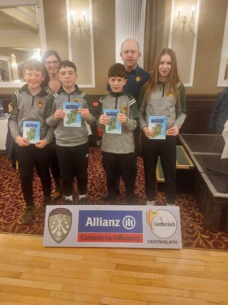 The winning team from Newtown-Dunleckney NS, Johnny McNamara, teacher Anita Donoghue, Conor Corcoran, Donnchadh Tunstead, former principal Muiris Bric and Ali Hughes