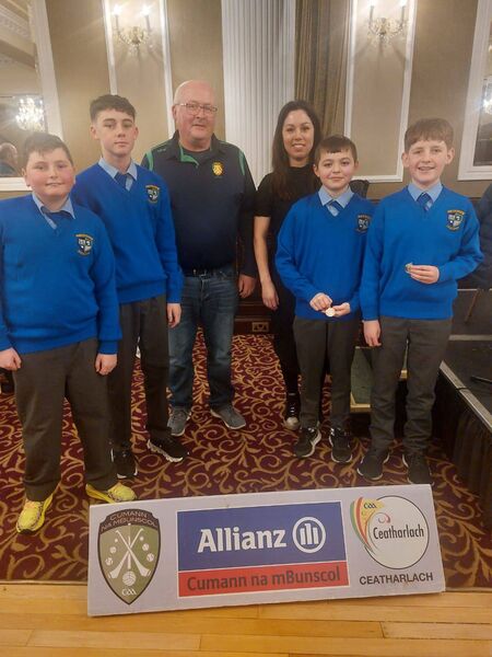 Second place St Brigid's NS, Bagenalstown, Liam Plant, Reece Power, chairman of Cumann na mBunscol Ceatharlach Hamish Beaton, teacher Irene Cahill, Ben Cole and Hugh O'Brien