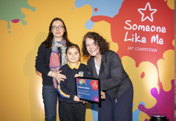 Second class pupil Hannah Cummins with her mother Jill Kelly and Director of the National Disability Authority, Dr Aideen Hartney Photo: Gareth Chaney