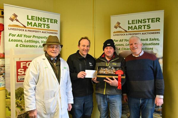 Winner of the best bullock Noel Kelly with Jimmy Walsh mart manager, Noel from Farm Relief Services and John Brennan chairman of Leinster Marts