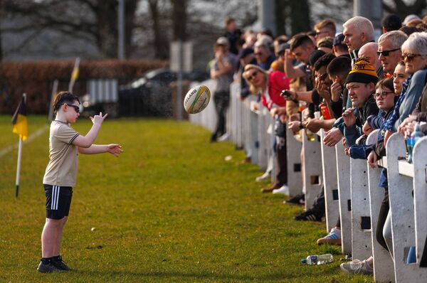 A young fan practices his passing technique during the Towns Cup match between Carlow and Longford in Oak Park. Photo: michaelorourkephotography.ie