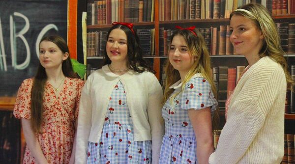 Sara Nolan as Ms Honey and Fallon Cotter as Matilda with Aleksandra Potocka as Matilda and Shauna Fitzpatrick as Ms Honey