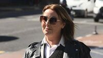 Ex-partner of gun murderer proclaims innocence after jury convicts her of impeding investigation
