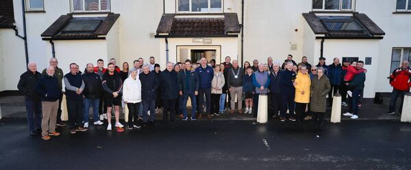 Members of the Ellis and Brennan families with Éire Óg members at the opening of the Anne Brennan Éire Óg Training Hub