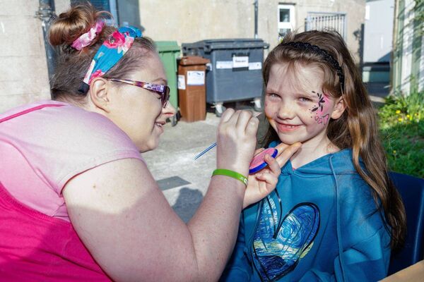 Lucy Gleeson has her face painted by Caoimhe O'Leary