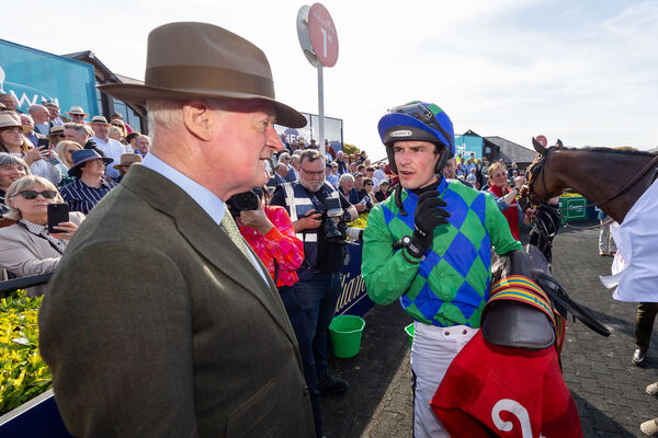 Danny Mullins and Willie Mullins celebrate winning The Dooley Insurance Group Champion Novice Steeplechase with Champ Kiely