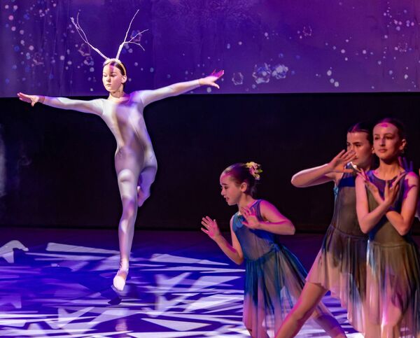 Carys Donohue McCaffery leaps onto the stage as the White Stag