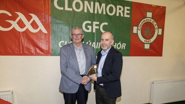 <p>Jim Boland presents the club person of the year award to Ted Forde</p>