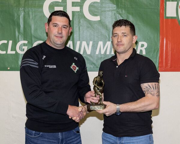 Clive Lambe presents the junior B player of the year award to Owen Coleman Clive Lambe presents the junior B player of the year award to Owen Coleman