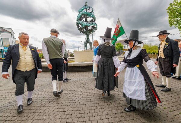 Welsh visitors perform a traditional dance at the Library Tree 