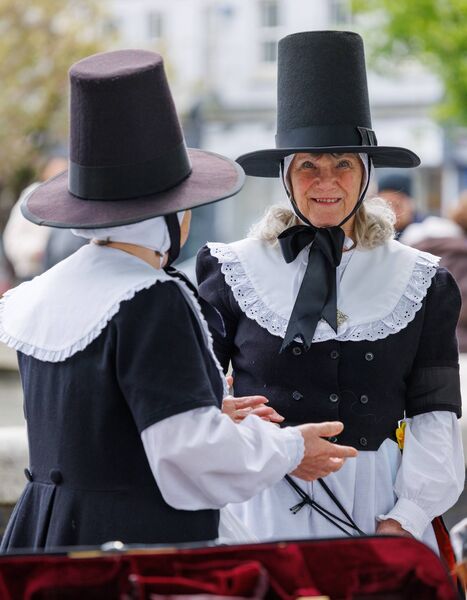 Two of the Welsh visitors pictured in traditional costume at the Library Tree in Carlow