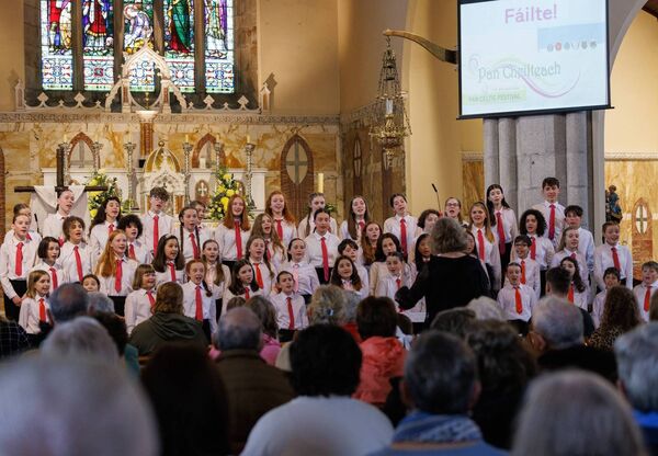 Members of the Cór na nÓg choir performing during their concert in St Clare's Church, Graiguecullen as part of the Pan Celtic Festival