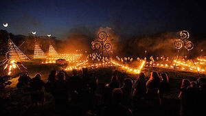 Spectators gather for ancient Celtic fire procession that welcomes summer