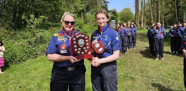 Marie Rowe, Carlow/Kilkenny Scout ACPC, presents the County Shield to patrol leader Charley Yeates of the Sionnach Patrol, Fifth Carlow Town Scout Group