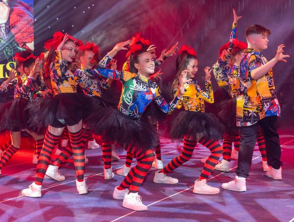The 12 to 14 group performing during Spotlight Stage School's 30th anniversary show 