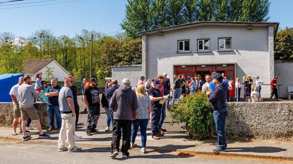Queuing up outside Spellman Hall in Kildavin to register for the tractor run in aid of St Brigid's Church