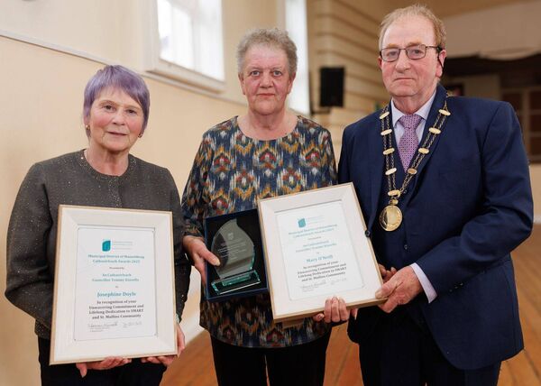 Cllr Tommy Kinsella presents a Cathaoirleach Award to Josephine Doyle and Mary O'Neill