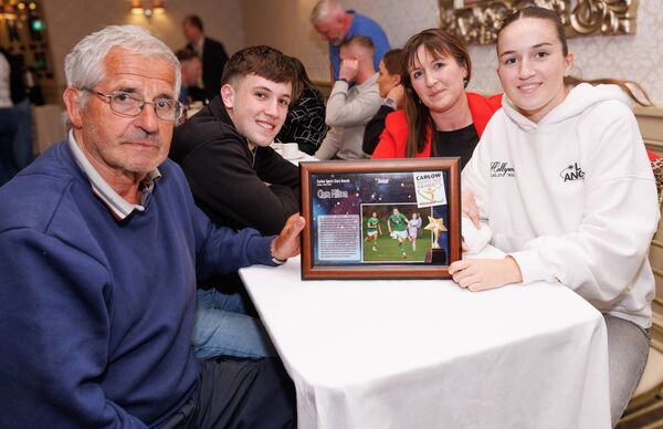 Ciara Milton with her mother Sinead, her brother Jack and grandfather Sean Phelan at the recent Nationalist Quarterly Sports Awards where she was a winner Photo: michaelorourkephotography.ie