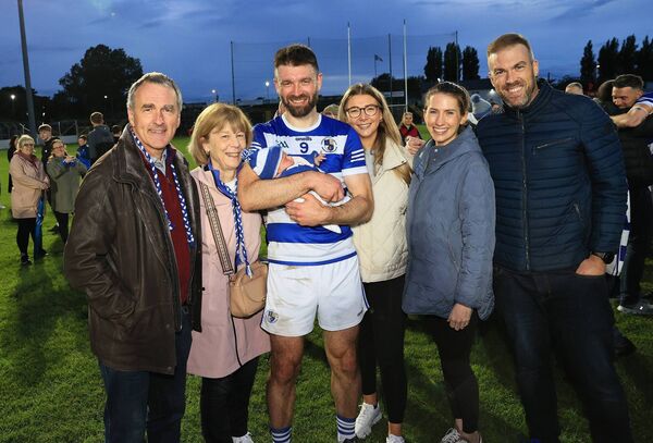Shane Redmond, with baby Ríadh in his arms, and his family celebrate Tinryland's victory over Rathvilly 	Photo: Pat Ahern