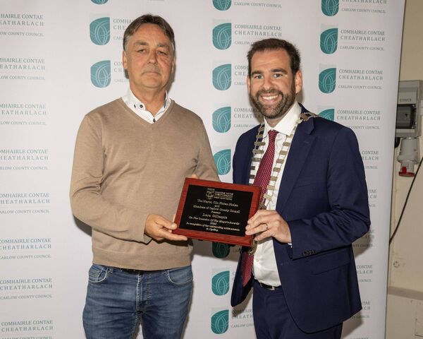 Trevor Gillespie accepts the Mayor's Award on behalf of his daughter Lara Gillespie