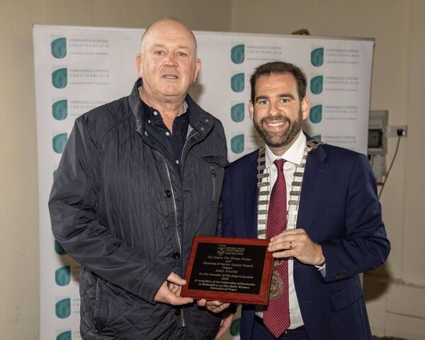Andrew Dooley accepts the Mayor's Award on behalf of his daughter Amy