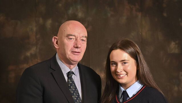 <p>Senior Student of Year Aoife Moody with principal Ray Murray</p>