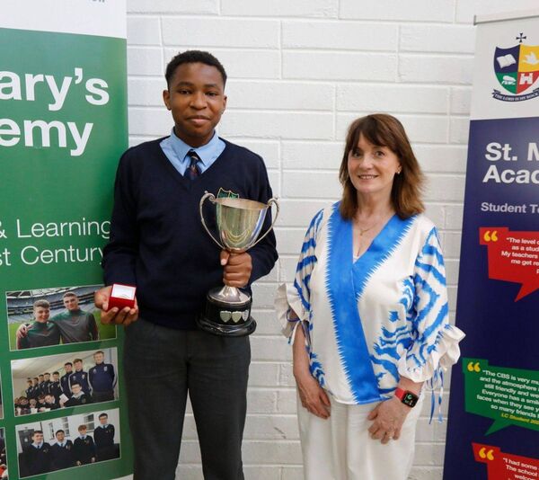 Clifford Mommoh, winner of the Pat Meany Award at St Mary's Academy CBS Carlow, with Joan McKeon 