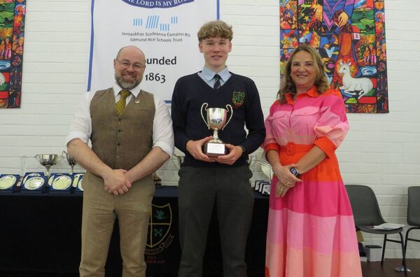 Jan Flejszar, winner of the Séan O'Ceallaigh Cup (sixth-year student of the year) with teacher Shane Story and principal Fiona Lennon