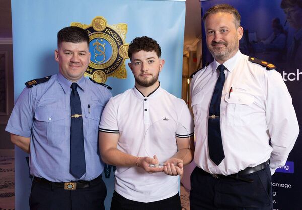 Danny Carter, winner of the Kilkenny/Carlow Garda Youth Area Award, with Garda Noel Byrne (Carlow Garda Station) and Superintendent Sean O'Meara (Kilkenny Garda Station)