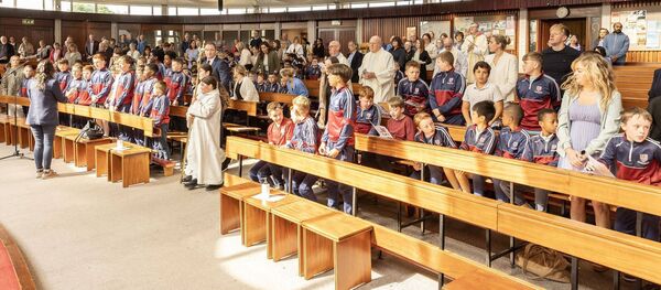 The boys, teachers and staff of the Holy Family Boys School arriving for their Mass in Askea church Photos: Thomas Nolan 