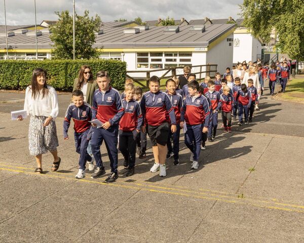 Some of the boys from the Holy Family Boys School in Askea being lead into the church by their teachers