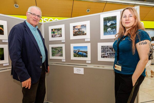 Tom Geoghegan and Inese Auzina pictured with their photographs in the Carlow Photographic Society exhibition