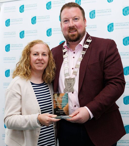 Cllr Brian O'Donoghue presents a Cathaoirleach Award to Mary Cunningham 