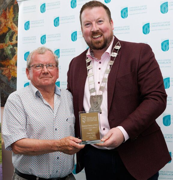 Cllr Brian O'Donoghue presents a Cathaoirleach Award to Johnny Kelly